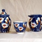 three pottery jugs and pots