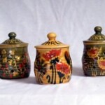 three jars with flower designs