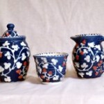 three pots with blue design