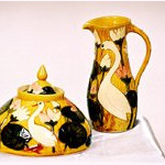 yellow pot and jug with swan design