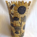 pot with yellow flowers and bee design